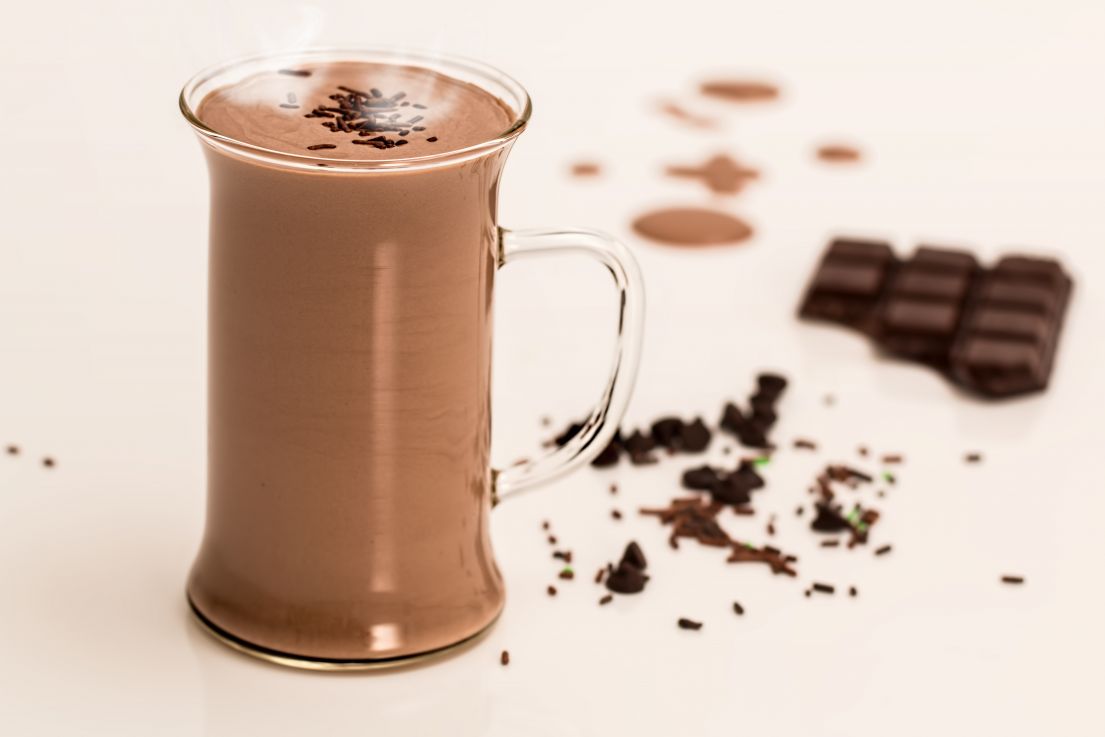 An image of Hot chocolate in a glass mug.