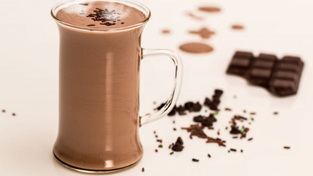 An image of Hot chocolate in a glass mug.