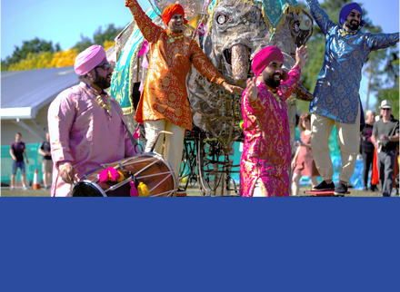 Men in colourful clothing dancing.