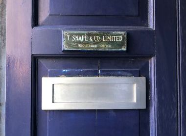 The printer's nameplate on the front door.