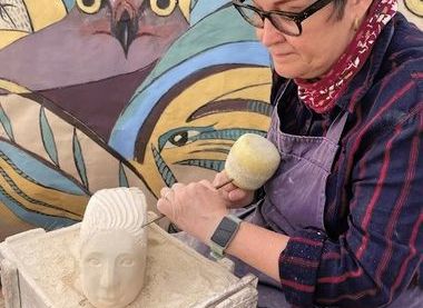 Sculptor Antonia Hockton demonstrating her skills in the marquee in 2025