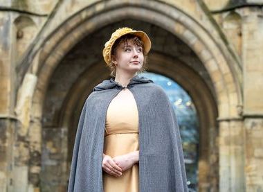 Volunteer dressed as Jane Austen outside the Abbey Gateway, image courtesy of REDA