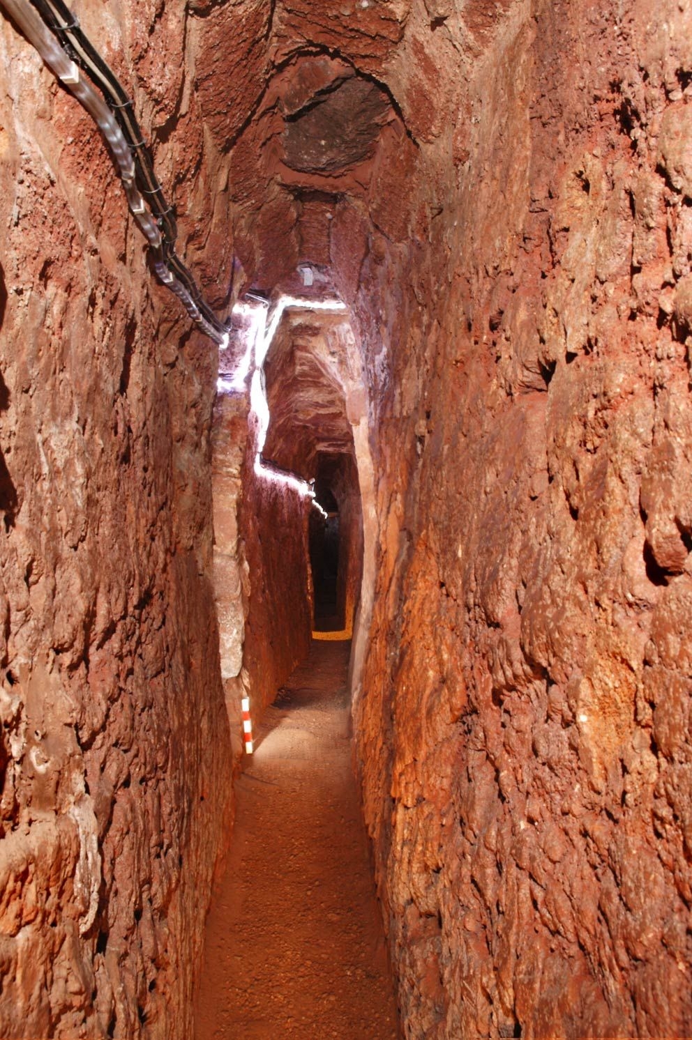 Very narrow stone brick passage.