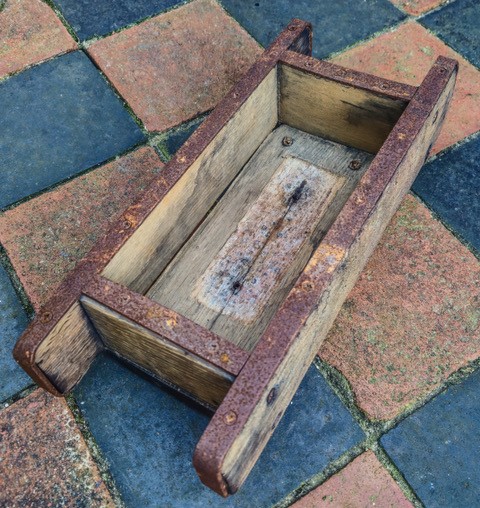 Simple rectangular wooden mould.