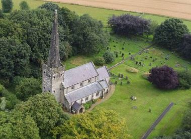 An aerial view St Mary's church and churchyard Huggate