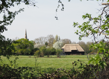View of the historic Tithe Barn and All Saints' Church