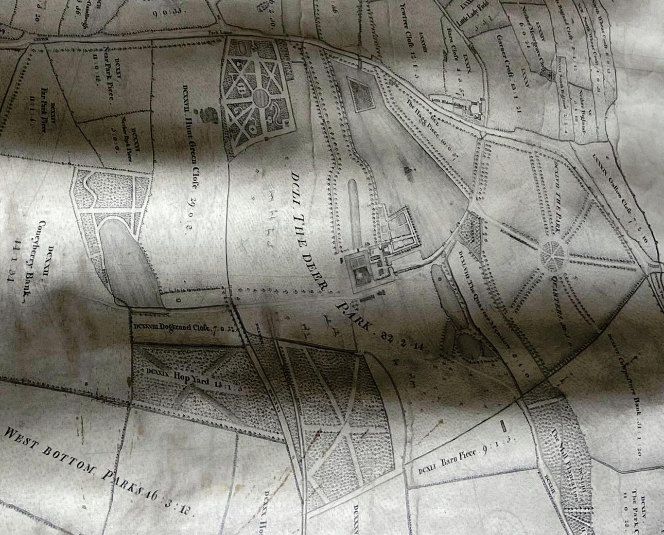 Map with small patterned garden in corner and a hop yard marked below the deer park.