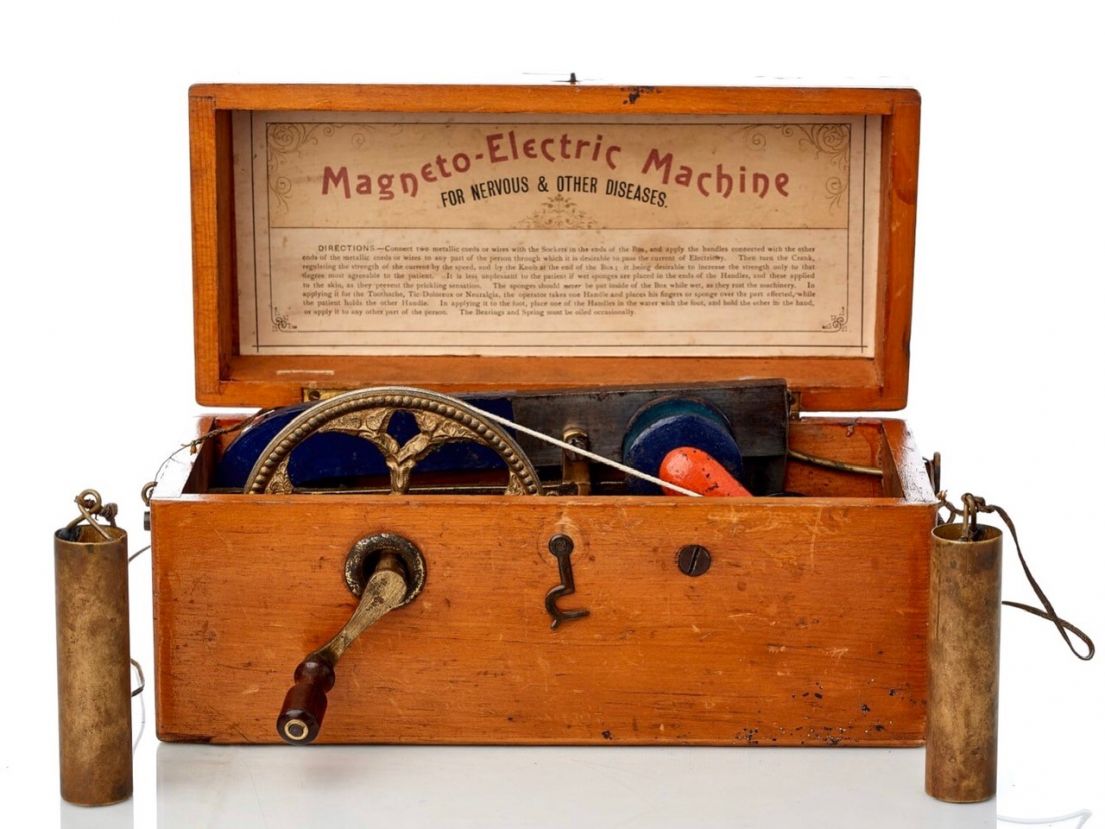 A wooden box holding a 'Magneto- Electure' machine, 'used to treat nervous and other diseases'