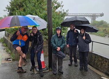 Happy walkers even in teeming rain