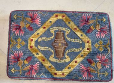 Kneeler commemorating two of the original bells