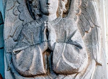 Carving of an angel on the north and south sides of the entrance to the Chancel