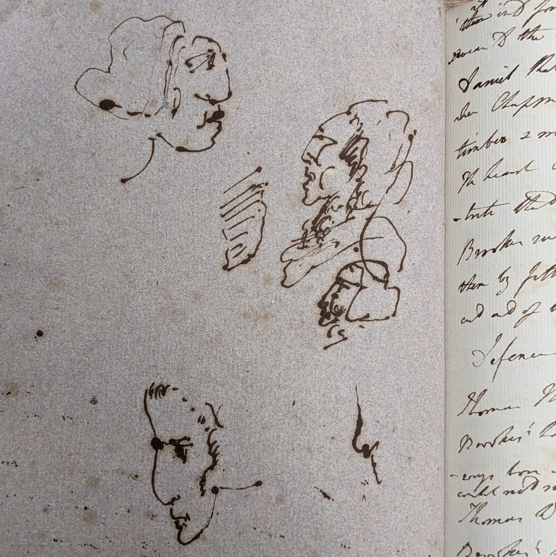 Three sketch of different faces in old ink.